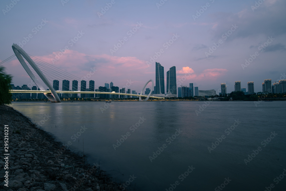 The Youth Olympic Center and Nanjing Eye Pedestrian Bridge in Nanjing City at Sunset