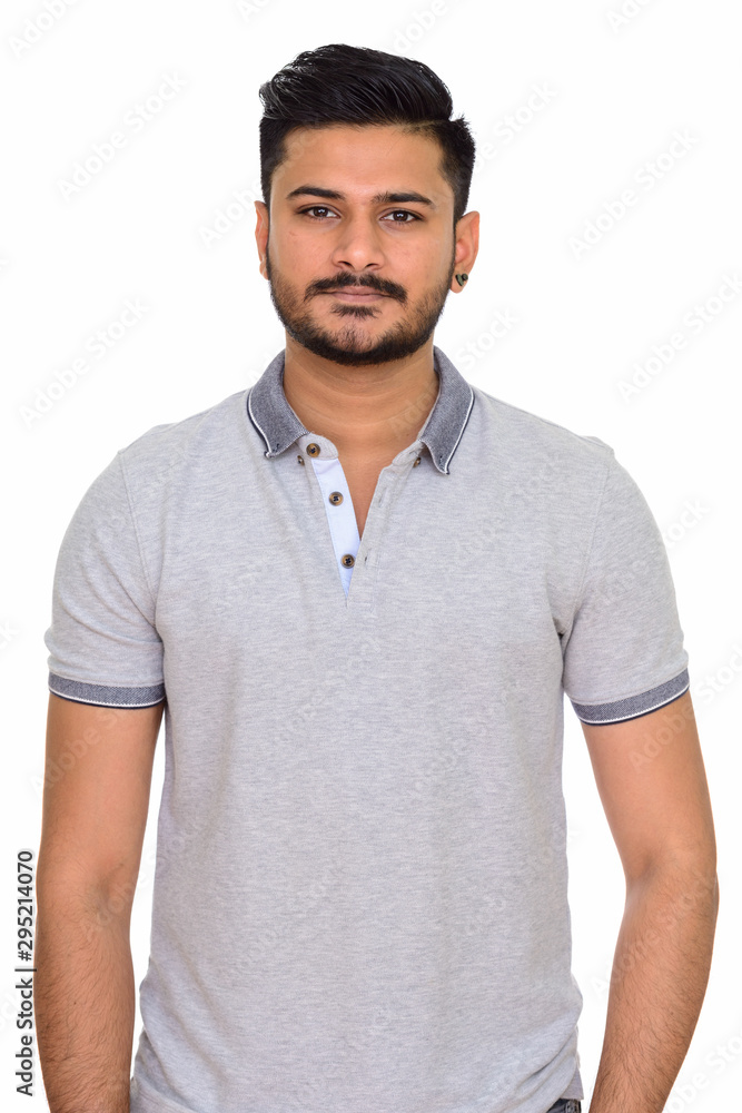 Young handsome Indian man isolated against white background Young handsome Indian man isolated against white background