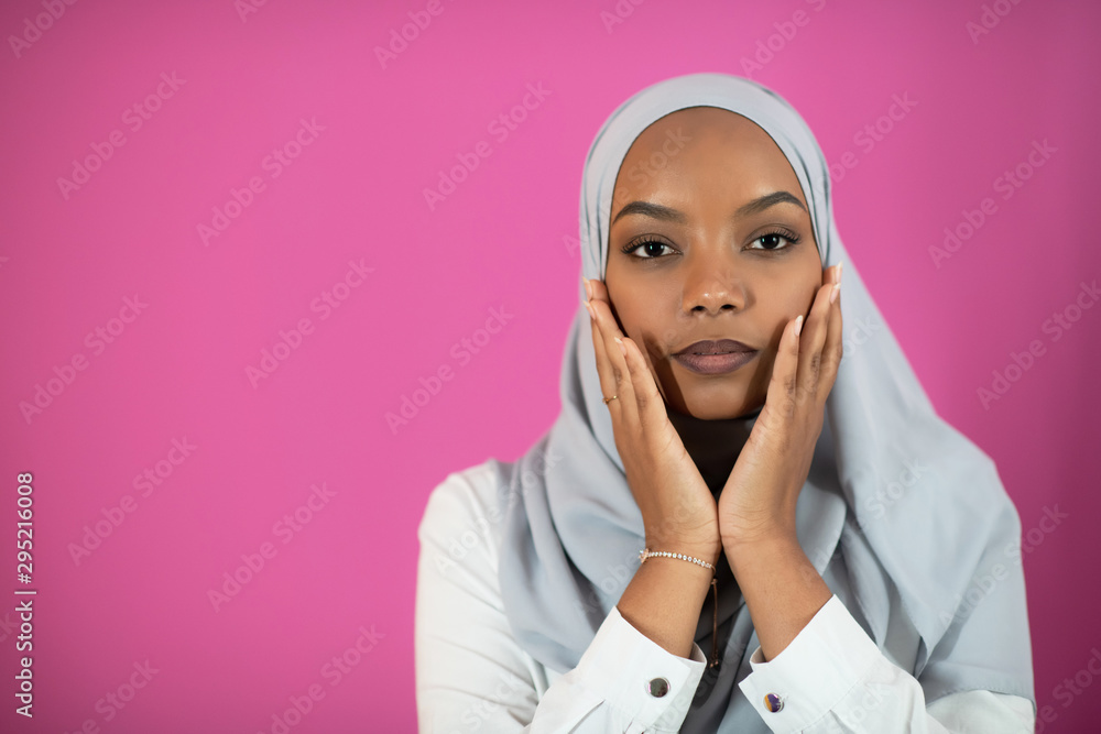 African Muslim woman makes traditional prayer to God African Muslim woman makes traditional prayer to God