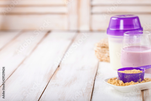 Protein and milk for milkshake. Sports food. Selective focus.