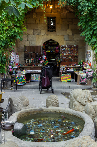 Old oriental antiques barass jungs and vases on street market in Baku, Azerbeijan. photo