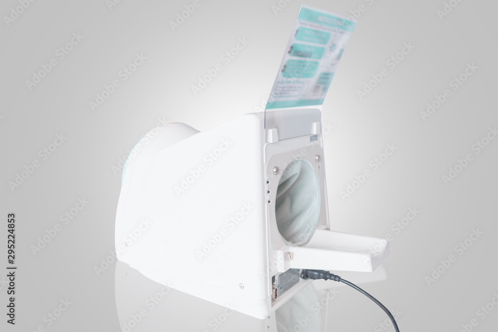Automatic Arm insertion blood pressure measuring machine isolated on white Automatic Arm insertion blood pressure measuring machine isolated on white