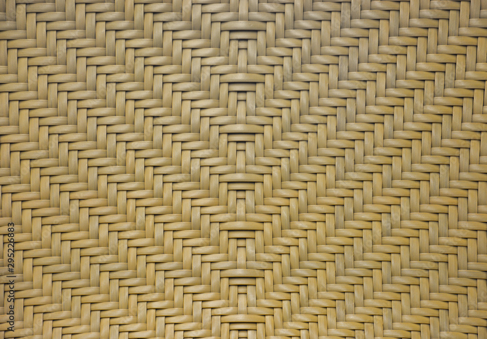 brown rattan woven in arrows pattern texture for background. brown rattan woven in arrows pattern texture for background.