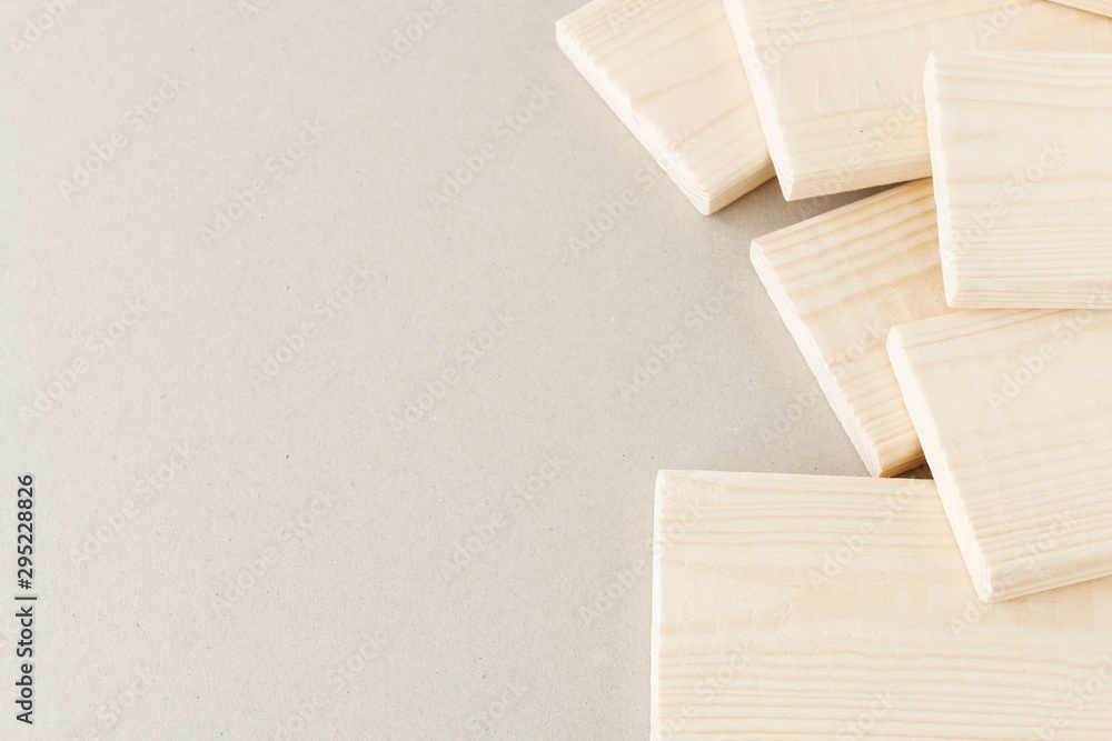 Stack of small planks on grey background