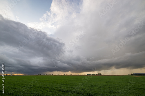 Stormclouds of a line of multicell thunderstorms over the dutch countryside north of Rotterdam, Netherlands