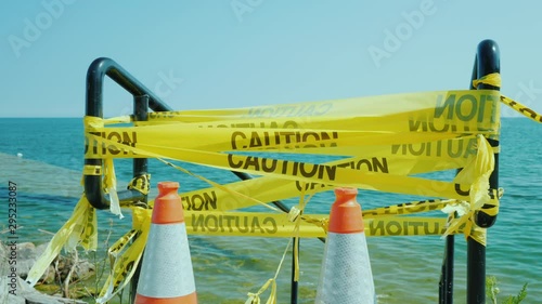Locked entrance to the marina or beach. Flooding and sea level rise