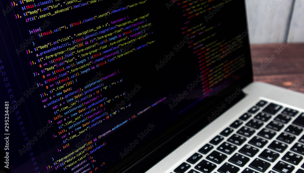 The screen of the program source code on the laptop placed on the desk ...