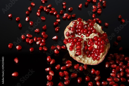 pomegranate fruit on black background.