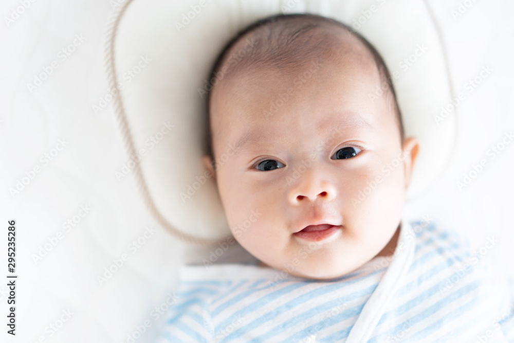 Baby lying on a crib