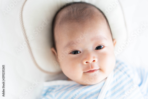 Baby lying on a crib