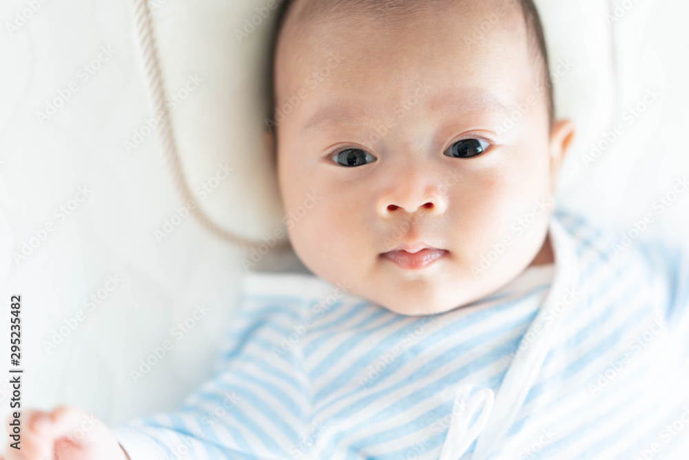 Baby lying on a crib