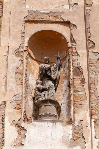 middle age statue at the outside of an old church in Mantin, CZ photo