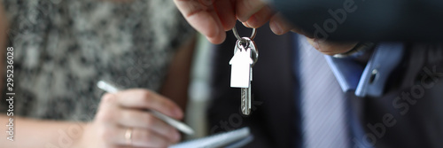 Quadro em tela Focus on male hands holding keys to housing