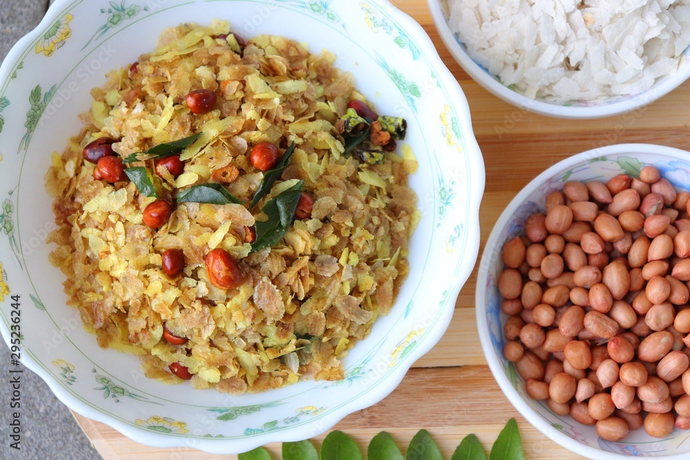 Indian savory snack Chivda or farsan. made out of Flattened rice, fried peanuts, curry leaves and some spices. Traditional Indian Diwali Snacks. Recipe ingredients along with Copy Space. Indian savory snack Chivda or farsan. made out of Flattened rice, fried peanuts, curry leaves and some spices. Traditional Indian Diwali Snacks. Recipe ingredients along with Copy Space.