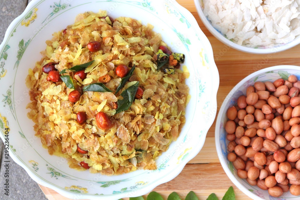 Indian savory snack Chivda or farsan. made out of Flattened rice, fried peanuts, curry leaves and some spices. Traditional Indian Diwali Snacks. Recipe ingredients along with Copy Space. Indian savory snack Chivda or farsan. made out of Flattened rice, fried peanuts, curry leaves and some spices. Traditional Indian Diwali Snacks. Recipe ingredients along with Copy Space.