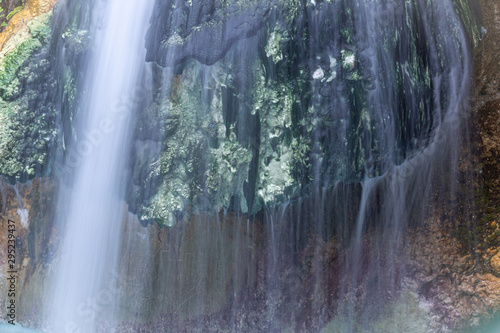 interesting unusual visible on a mountain waterfall on a sunny day for background or screensaver,