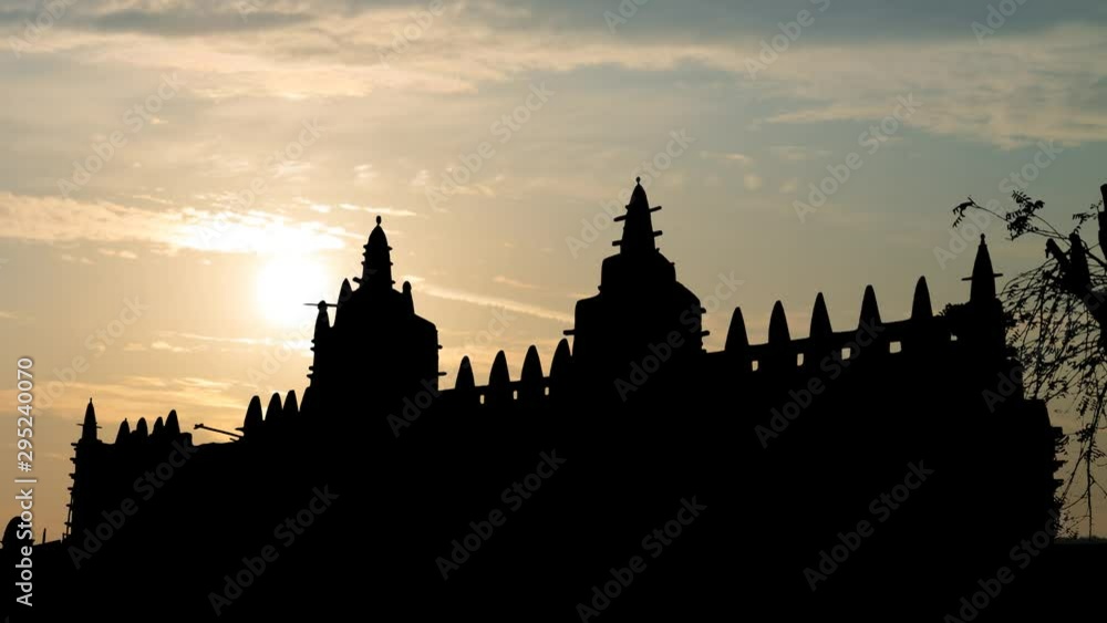 Great Mud Mosque of Djenne: Time Lapse at Sunrise with Coloful Clouds, one of the most Famous Landmarks in Africa, Mali Great Mud Mosque of Djenne: Time Lapse at Sunrise with Coloful Clouds, one of the most Famous Landmarks in Africa, Mali