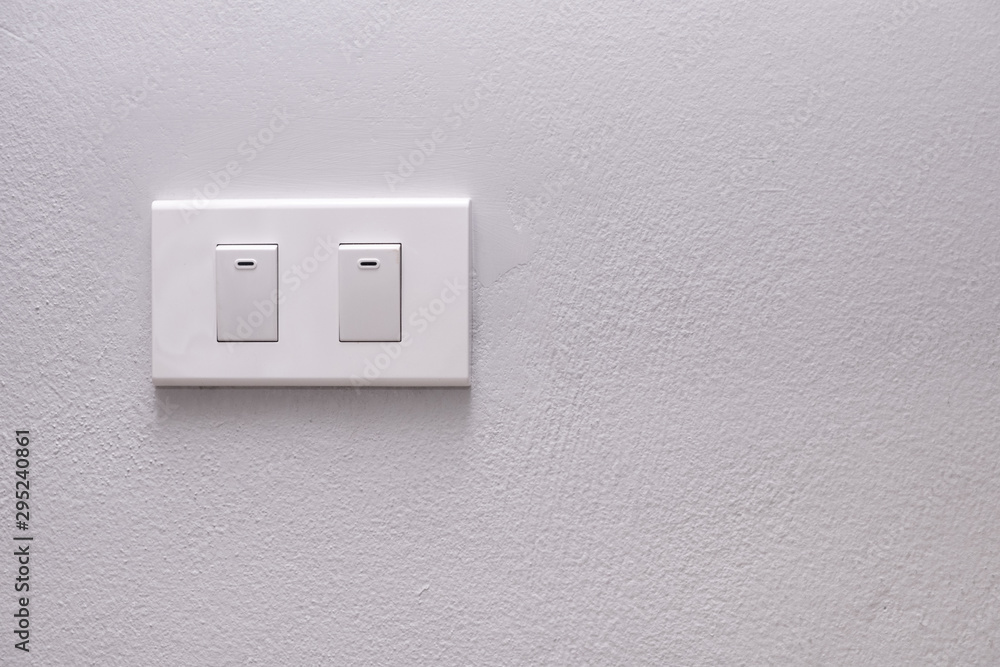 Electricity switch or lamp switch on white wall Electricity switch or lamp switch on white wall