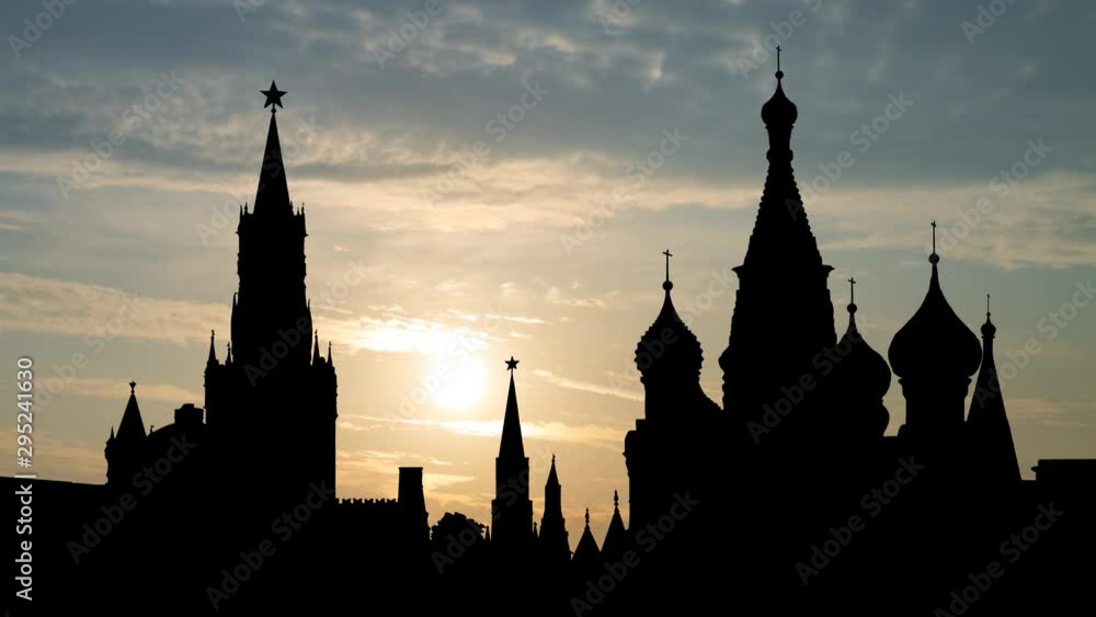 Moscow: Kremlin or Spasskaya Tower with Saint Basil's Cathedral in Red Square, Time Lapse at Sunrsie, Russia, Europe Moscow: Kremlin or Spasskaya Tower with Saint Basil's Cathedral in Red Square, Time Lapse at Sunrsie, Russia, Europe