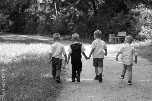 Children go together on the path In Park