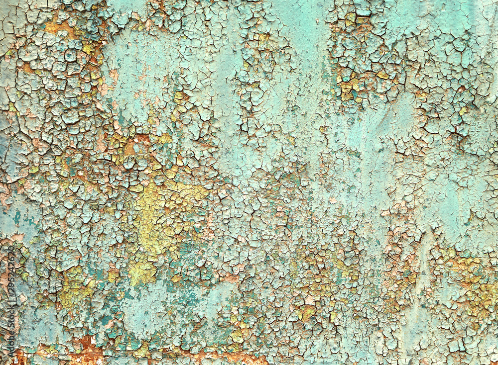 Old weathered peeling paint texture on rusty metal surface background