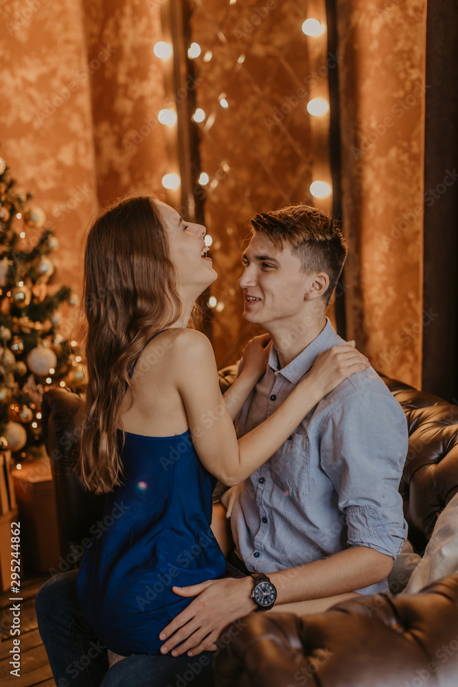Romantic couple in love feeling happiness about their romance spending christmas eve together- Image Romantic couple in love feeling happiness about their romance spending christmas eve together- Image