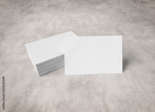 Stack of white business cards mockup isolated on concrete 3d rendering