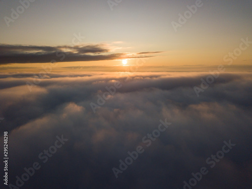 View above clouds during sunrise. Dramatic view the sky. © Mario