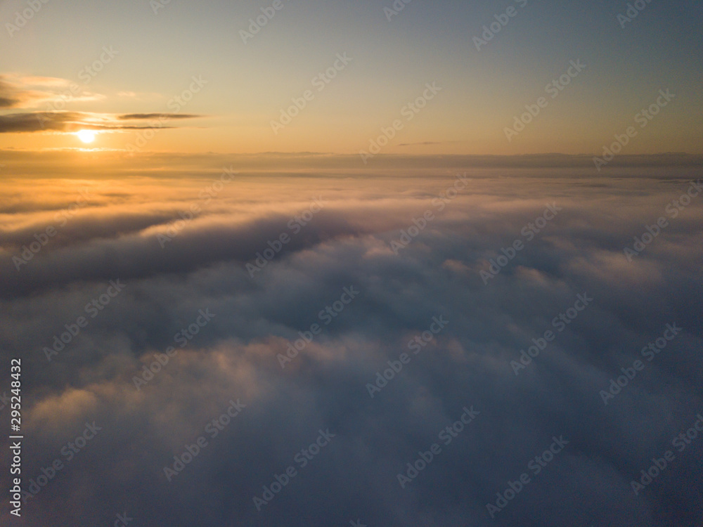 View above clouds during sunrise. Dramatic view the sky.