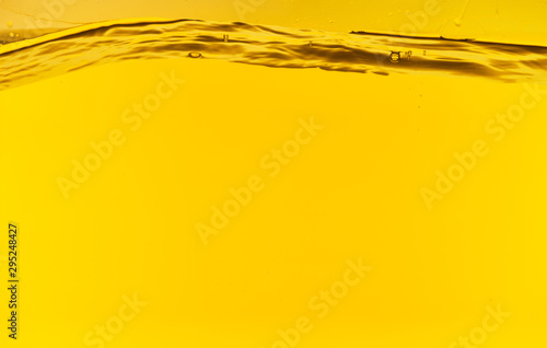 wavy clear deep water on yellow bright background