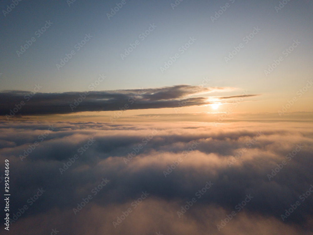 View above clouds during sunrise. Dramatic view the sky.