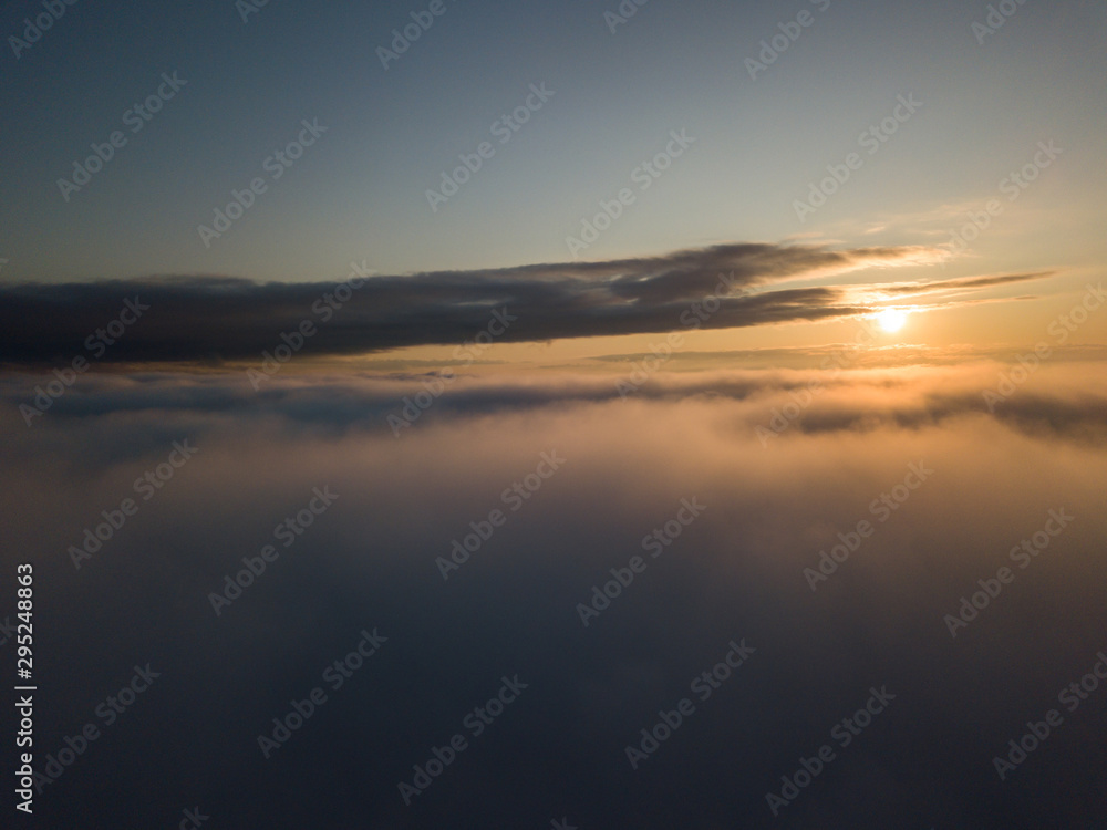 View above clouds during sunrise. Dramatic view the sky.