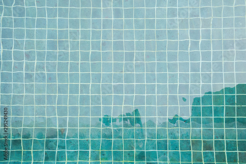 the aerial view of the swimming pool with blue water