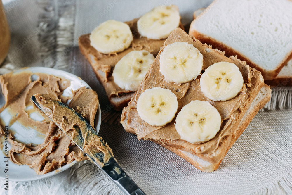 sandwich with peanut butter and bananas. Healthy and tasty breakfast or snack. sandwich with peanut butter and bananas. Healthy and tasty breakfast or snack.