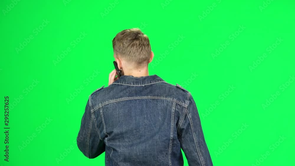 Back view of guy goes and talks on the phone. Chroma Key Back view of guy goes and talks on the phone. Chroma Key