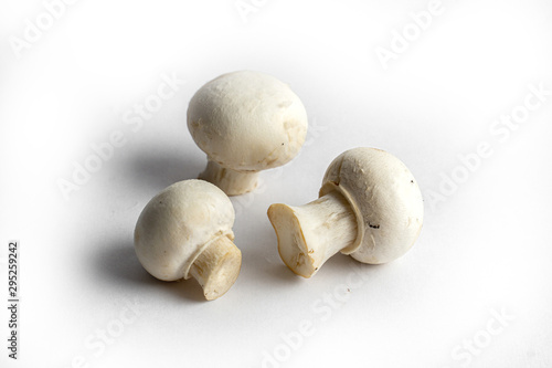 fresh champignon mushrooms on a white background