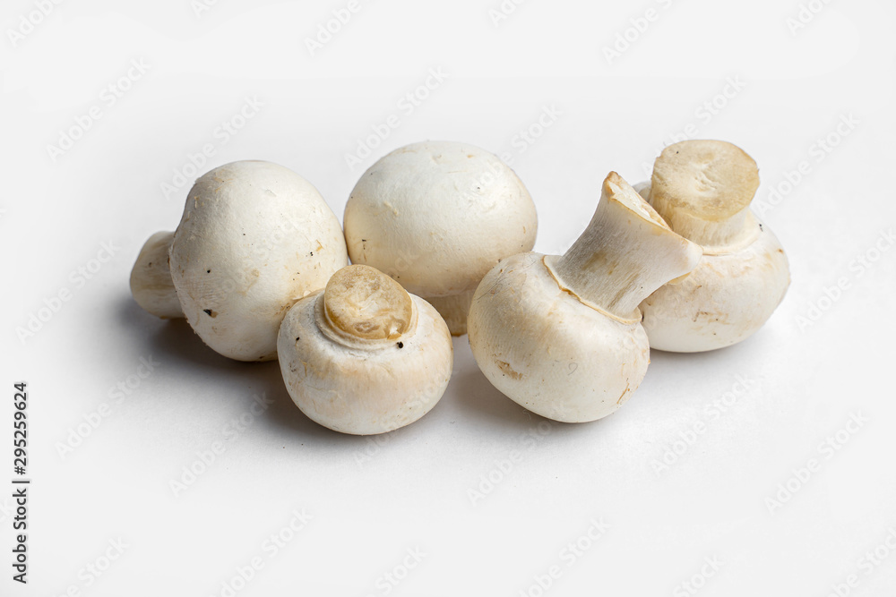 fresh champignon mushrooms on a white background fresh champignon mushrooms on a white background