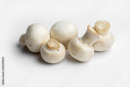 fresh champignon mushrooms on a white background