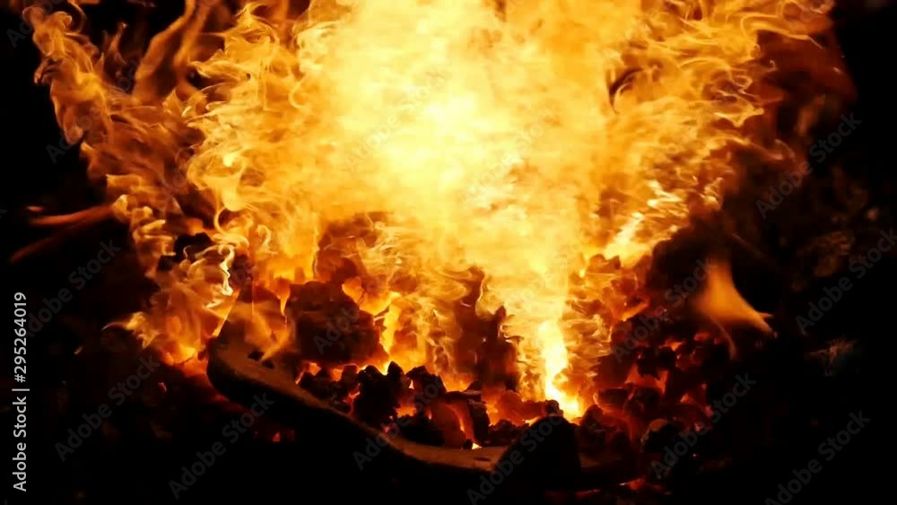 Black coal stove of blacksmith heating classic horseshoe. Blazing furnace at the blacksmith shop Black coal stove of blacksmith heating classic horseshoe. Blazing furnace at the blacksmith shop