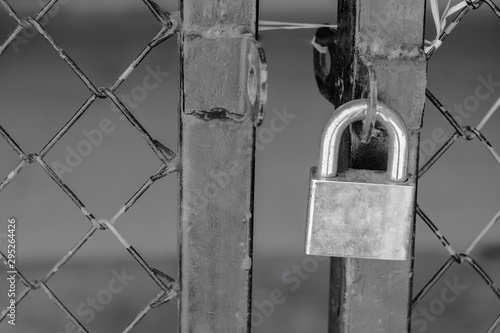 Gate locked by padlock on background.safty concept. © amnarj2006