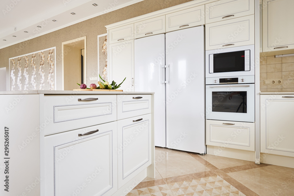 Island in the white kitchen in the classic style Island in the white kitchen in the classic style