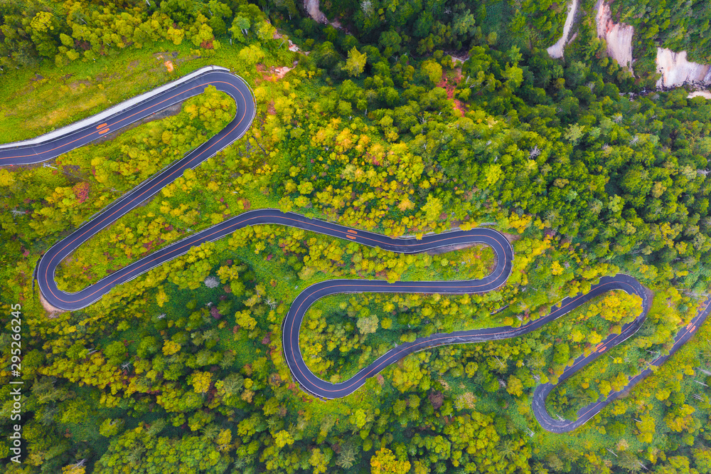 Aerial view of winding road on mountain in Autumn