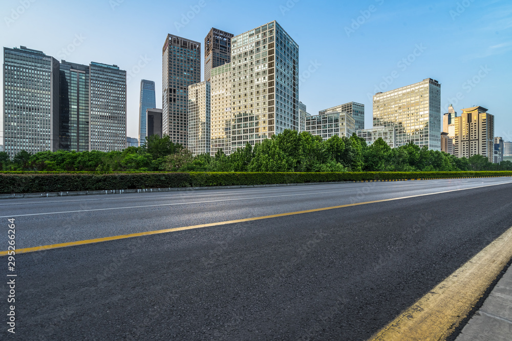 Asphalt road and modern city commercial buildings in Beijing, China