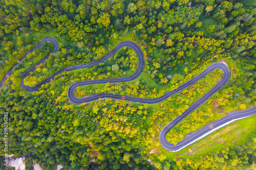 Aerial view of winding road on mountain in Autumn © structuresxx