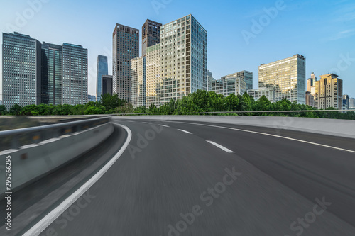 Asphalt road and modern city commercial buildings in Beijing, China