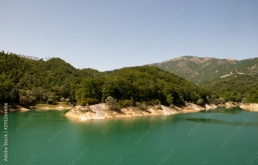Landscape on Lake Salto in Central Italy. Artificial Lake of Italy. Panoramic view of the Lake. Lake with creeks. Wild and unspoiled nature.