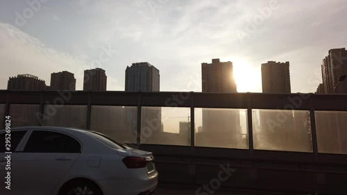 Fast highway going through the high-rise blocks of flats suburb in the city of Xian in summer morning, Shaanxi Province, central China photo
