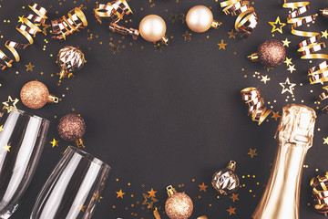 New Year composition with confetti, decorations and champagne.
