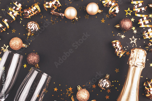 New Year composition with confetti, decorations and champagne.