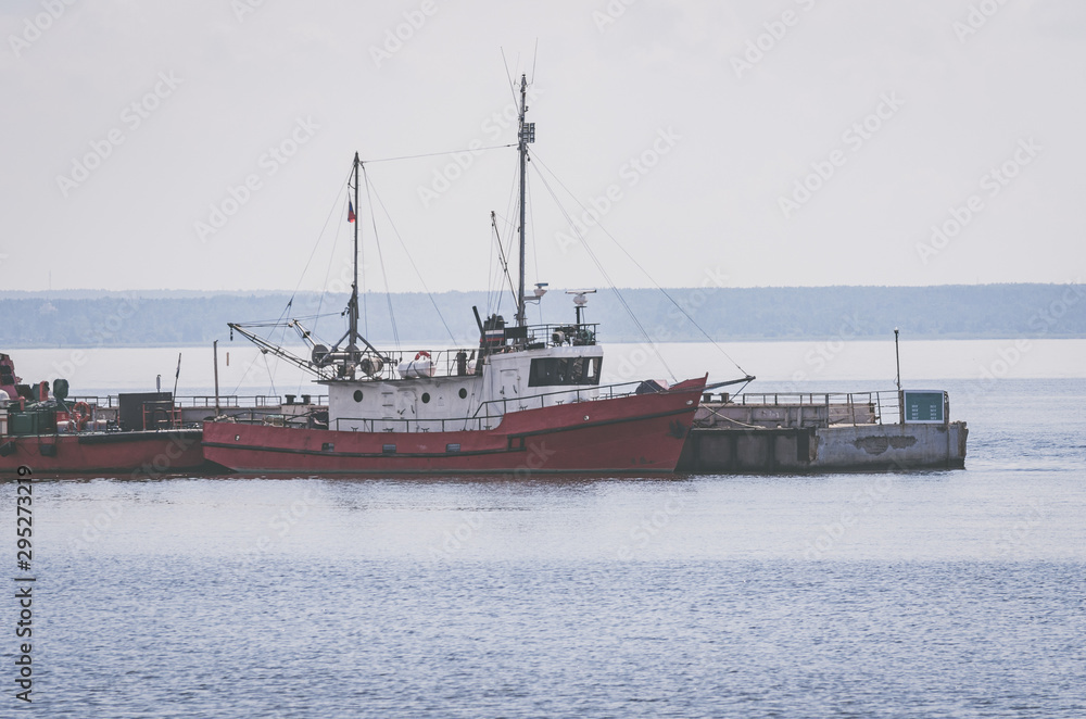 Kronstadt / Russia - 14/07/2018: Small boats moored to the pier